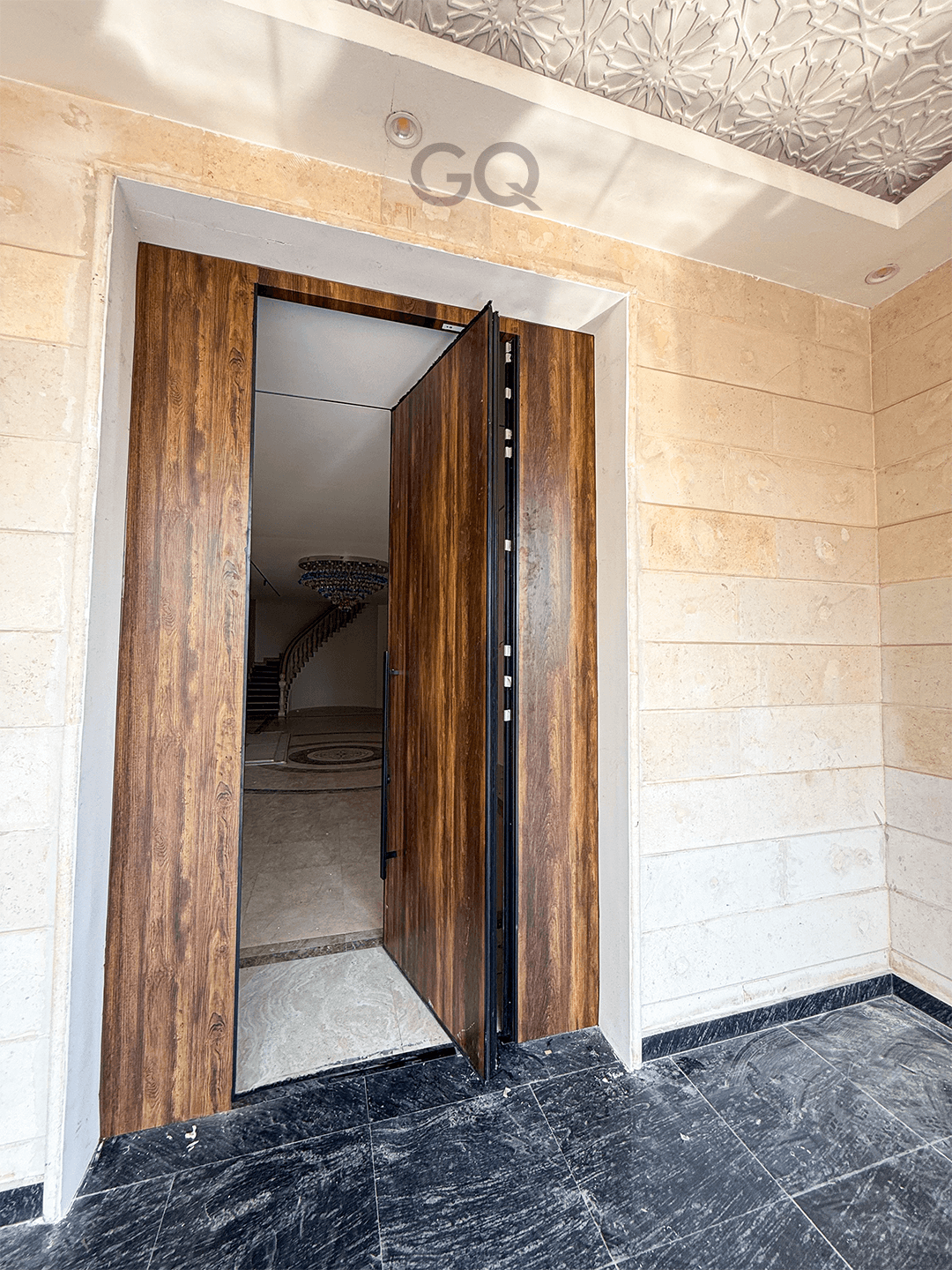 A German Quality pivot door installed in a Qatari villa entrance